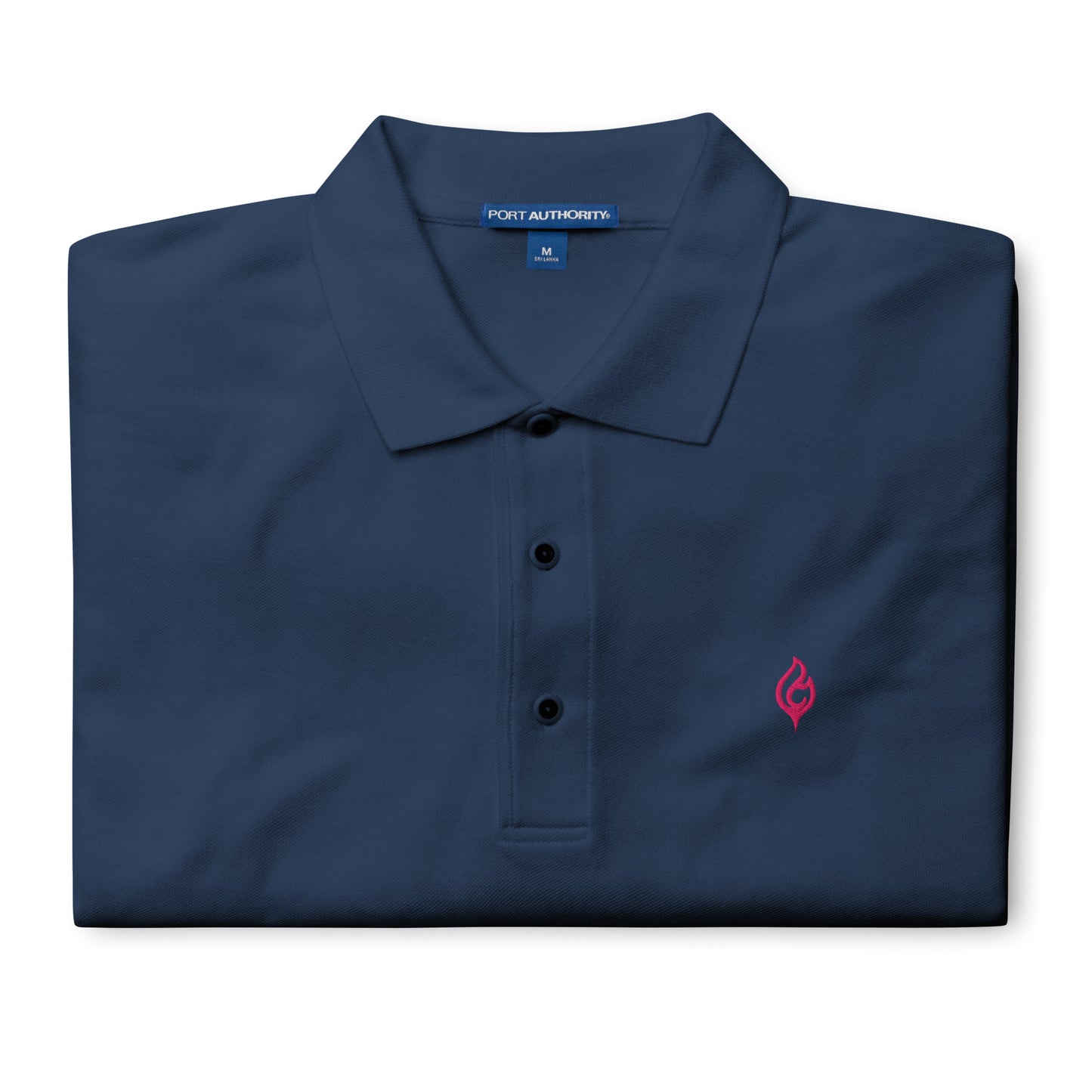Folded Ciao Cult Men’s Signature Flame Polo in navy showing flamingo-pink embroidered flame emblem.