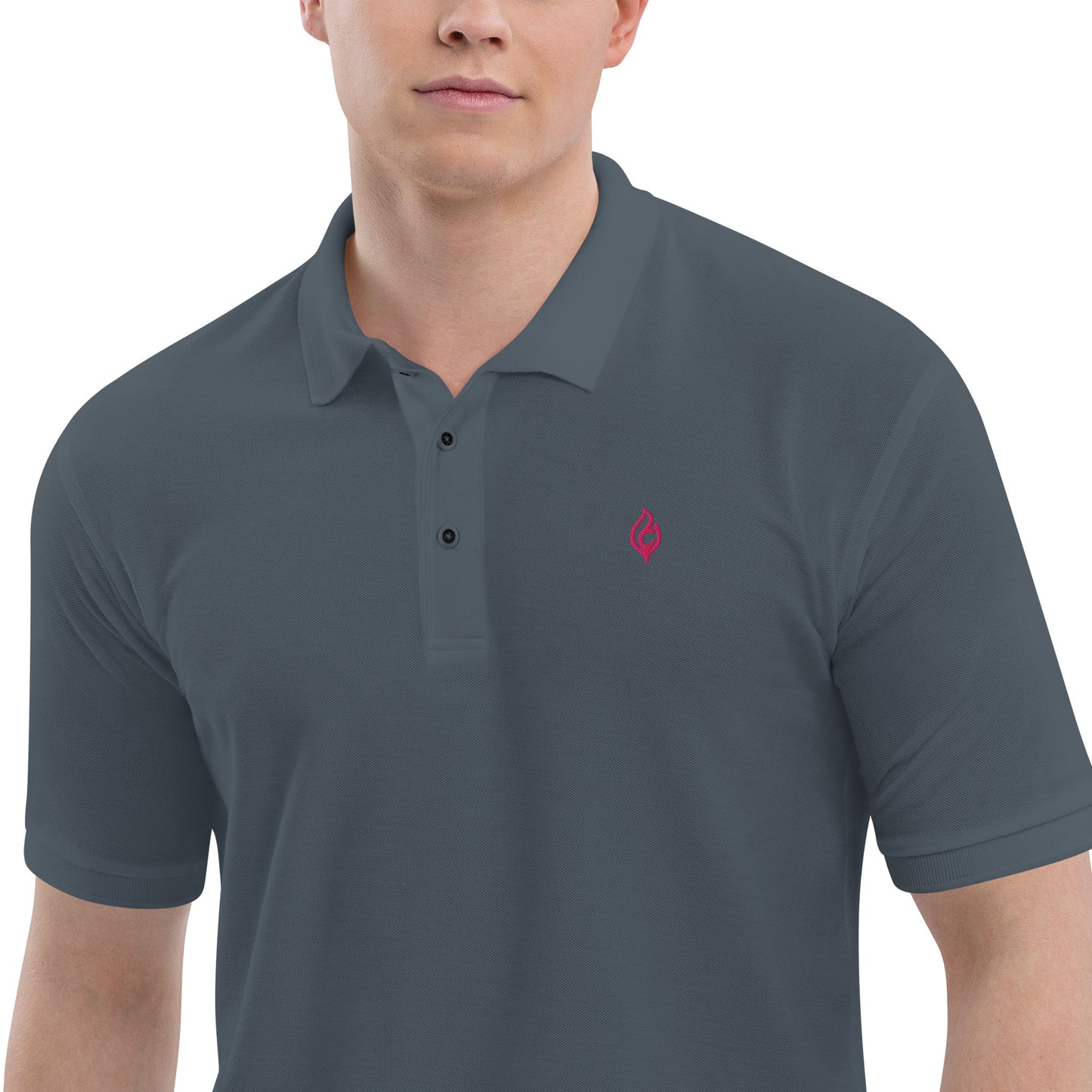 Close-up waist-to-jaw view of male model wearing Ciao Cult Men’s Signature Flame Polo in steel grey with flamingo-pink flame emblem.