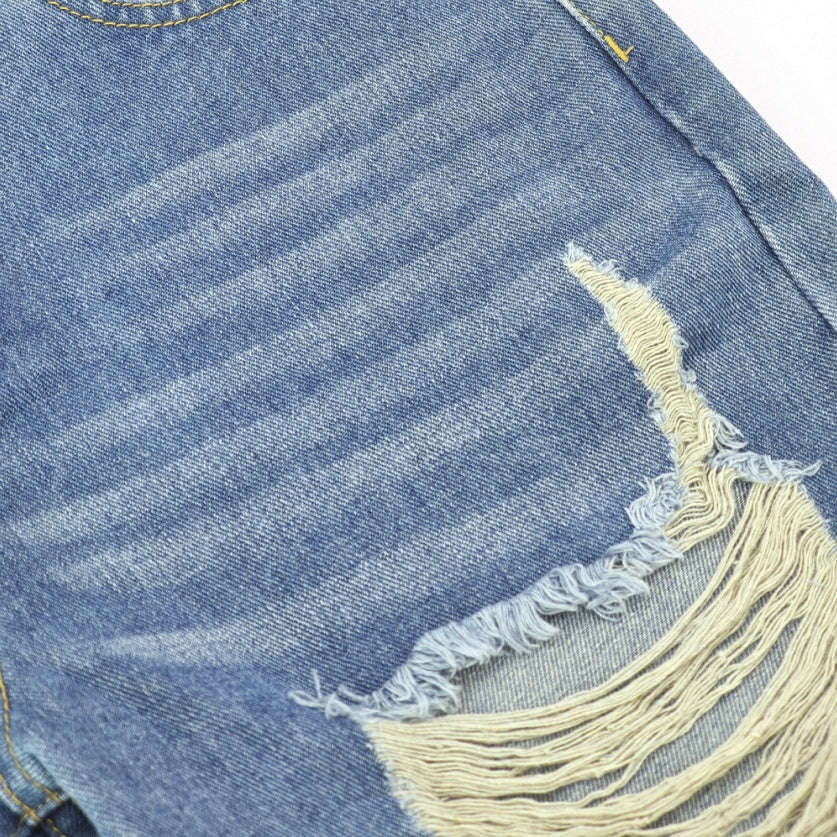 Close-up of Ciao Cult Women’s High-Waist Ripped Straight-Leg Jeans fabric showing worn creases above ripped section.