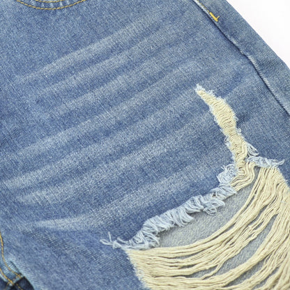 Close-up of Ciao Cult Women’s High-Waist Ripped Straight-Leg Jeans fabric showing worn creases above ripped section.