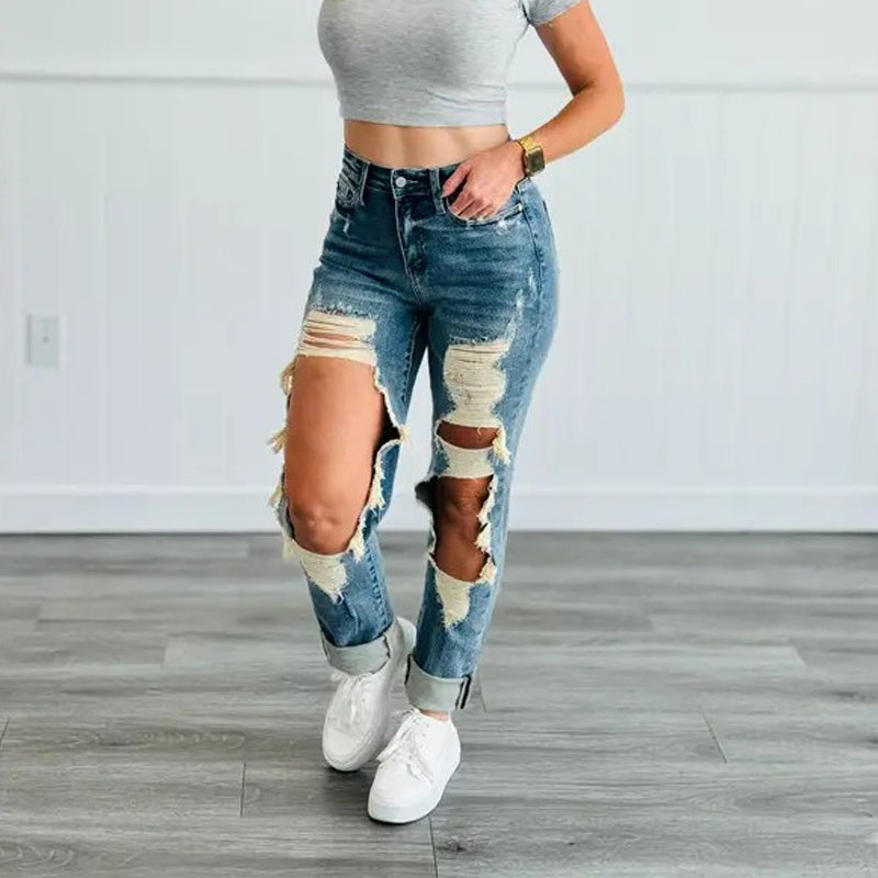 Side-turned model wearing Ciao Cult Women’s High-Waist Ripped Straight-Leg Jeans, right leg bent to highlight ripped thigh section.