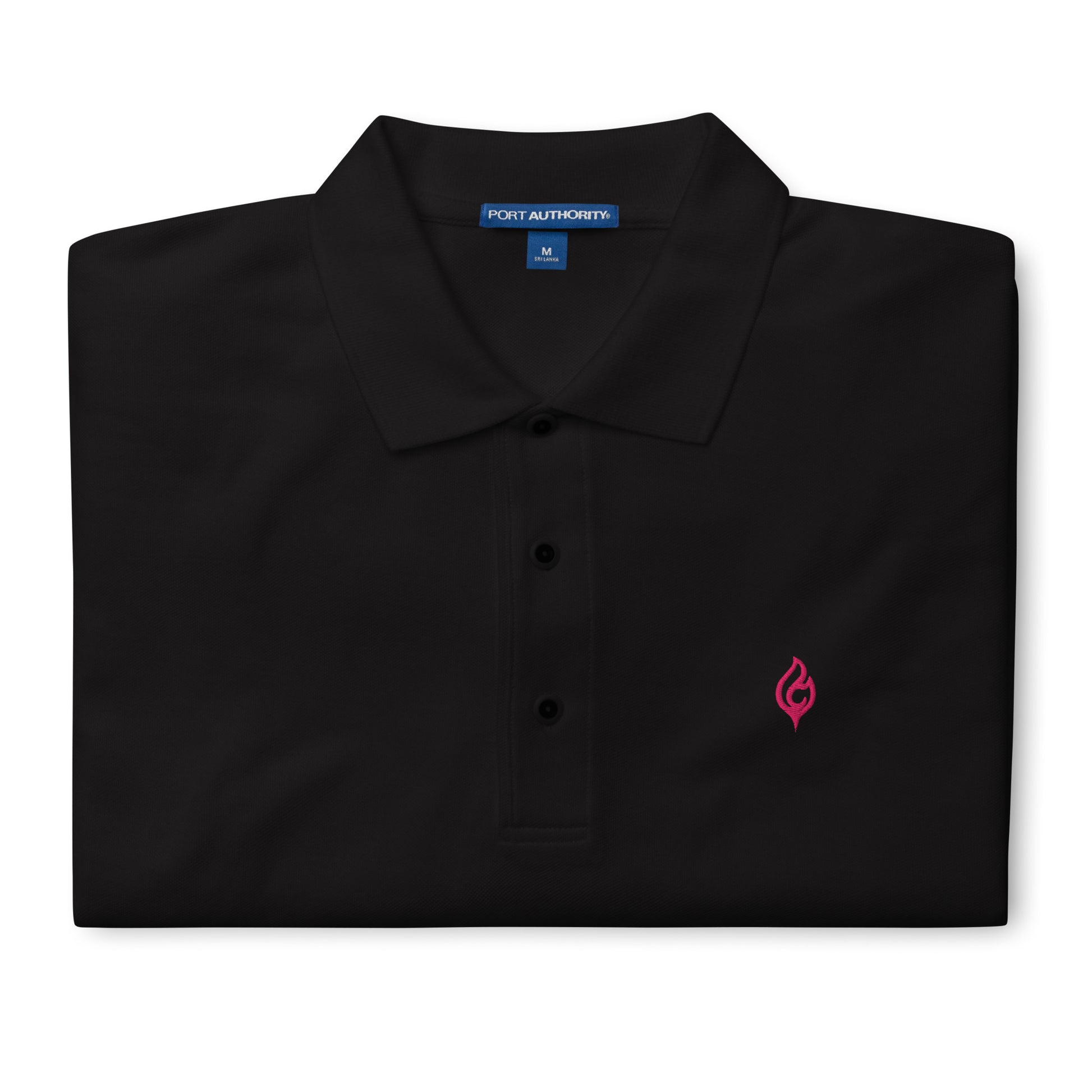 Folded Ciao Cult Men’s Signature Flame Polo in black showing flamingo-pink embroidered flame emblem.