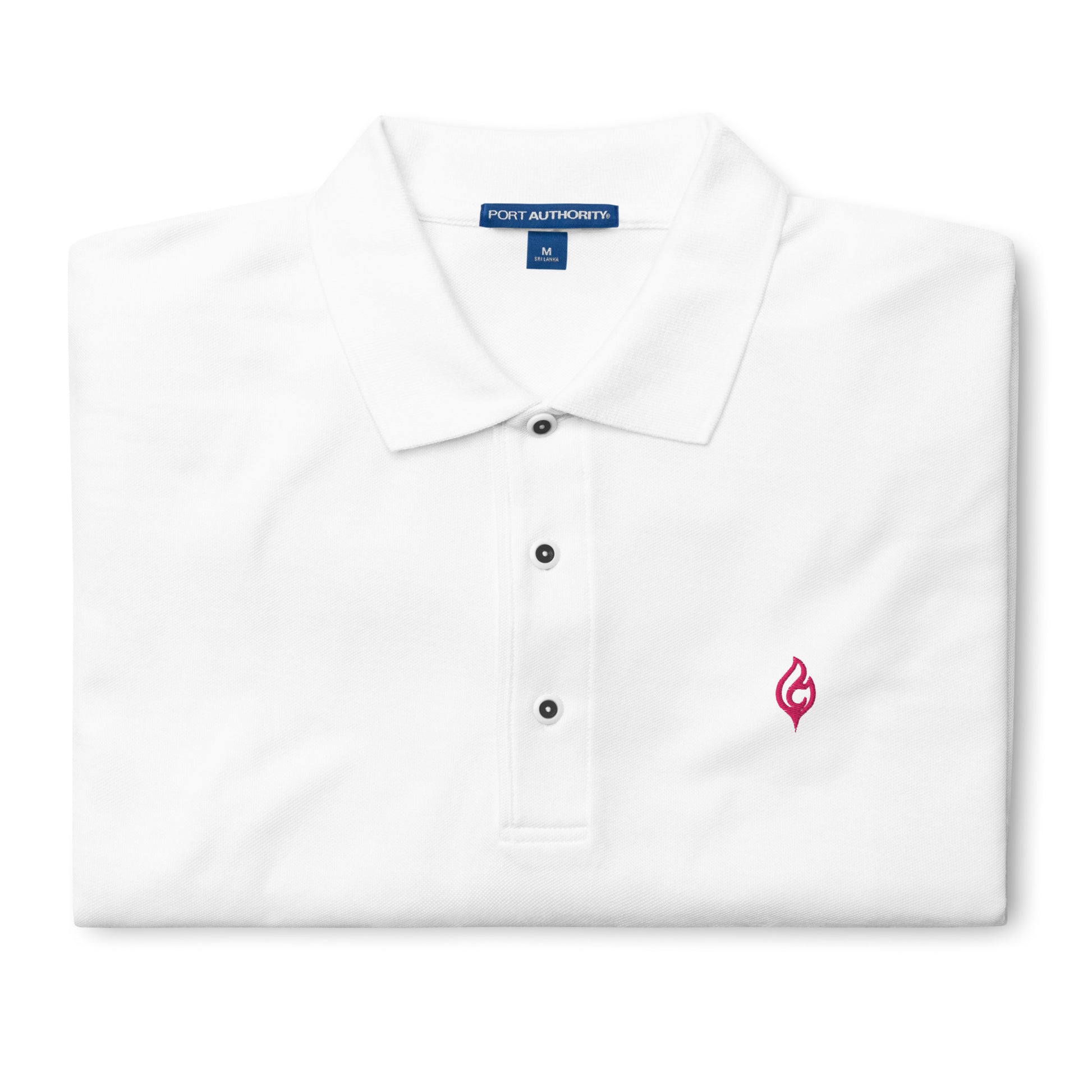 Folded Ciao Cult Men’s Signature Flame Polo in white showing flamingo-pink embroidered flame emblem.