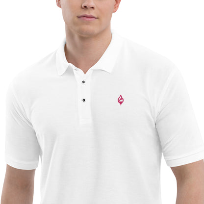 Close-up waist-to-jaw view of male model wearing Ciao Cult Men’s Signature Flame Polo in white with flamingo-pink flame emblem.