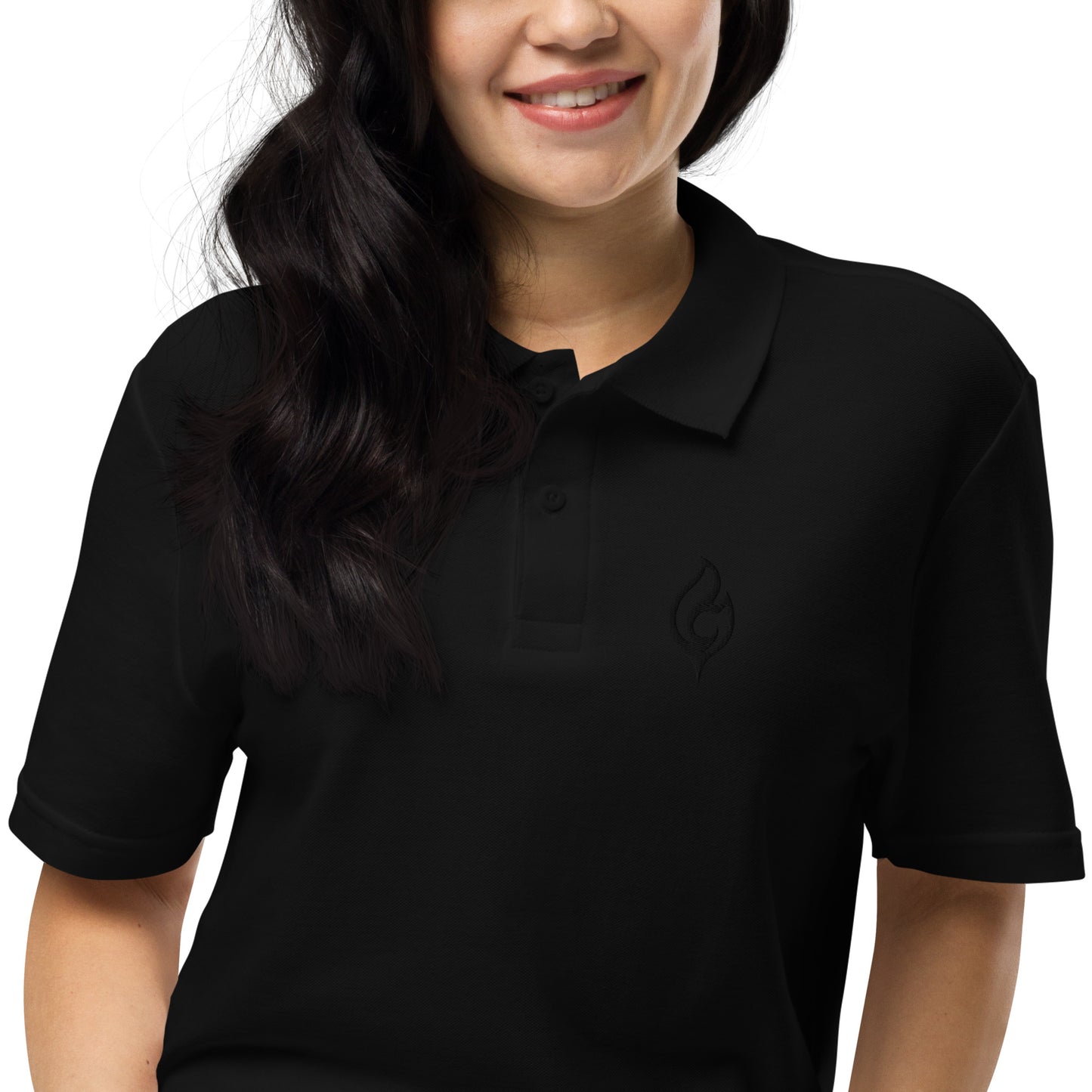 Close-up front view of female model wearing Ciao Cult Tonal Black-on-Black Signature Flame Polo, showing tonal flame embroidery.
