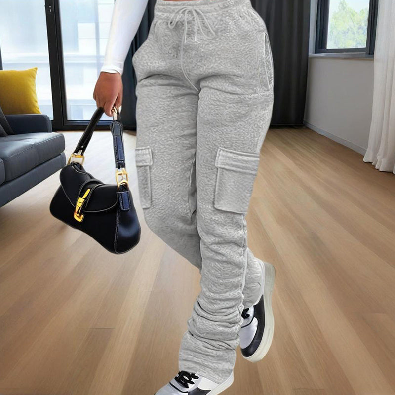 Model waist down wearing Ciao Cult Women’s Straight-Leg Pants in grey, front walking pose holding black purse.