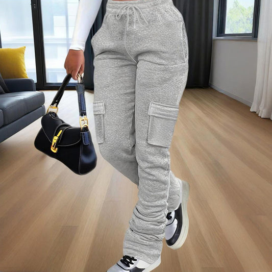 Model waist down wearing Ciao Cult Women’s Straight-Leg Pants in grey, front walking pose holding black purse.