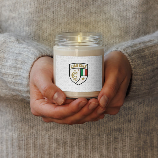Hand holding lit Ciao Cult Signature Crest scented soy wax candle with textured white label and Italian flag crest. - Ciao Cult - Apple Harvest