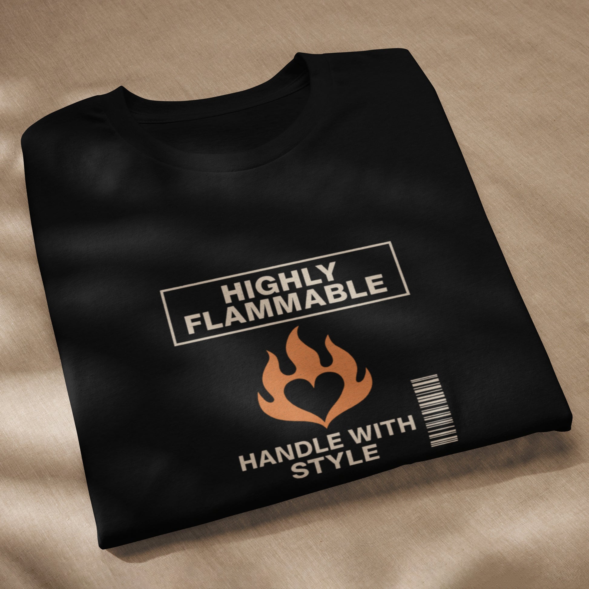 Black unisex t-shirt with beige "Highly Flammable" text, flame graphic, and barcode design. - Ciao Cult - Black / XS