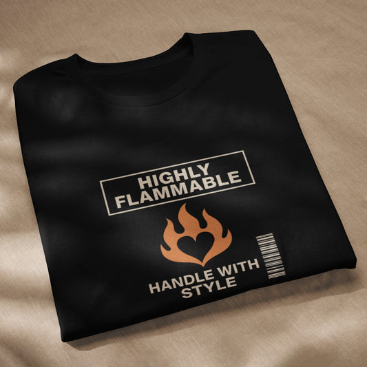 Black unisex t-shirt with beige "Highly Flammable" text, flame graphic, and barcode design. - Ciao Cult - Black / XS